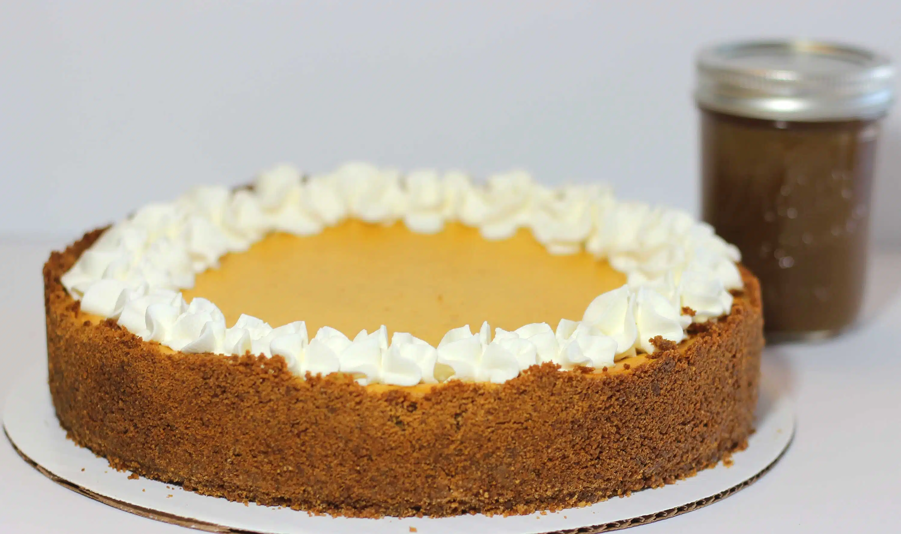 Photo of Pumpkin Cheesecake with Gingersnap Crust, by Cupcakeology